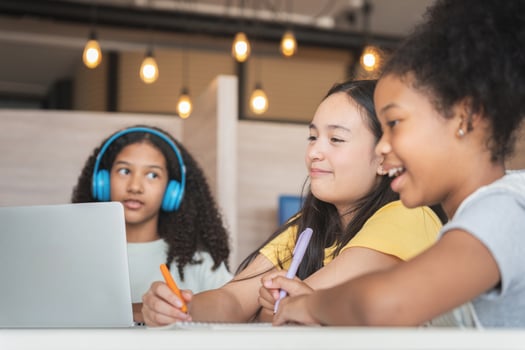 Diverse Group of Young Students Learning Together, Happy Girls Collaborating on a School Project, Teenagers Engaged in Online Education and Study photo