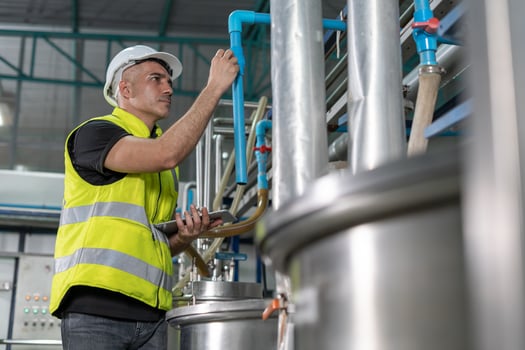 Engineers or factory managers wearing safety helmet inspect the machines in the production line. Utility inspector check machine and test the system to meet the standard. machine, maintenance, photo