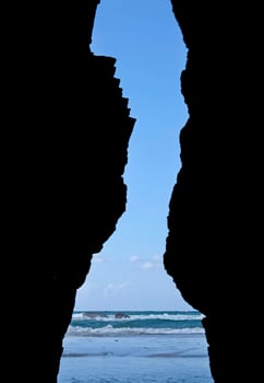 Looking through a gap in the cliffs the sea at Playa de las Catedrales, Galicia, Spain photo