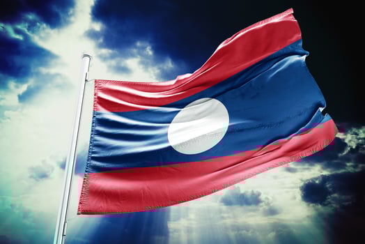 The laos flag is waving in the wind photo