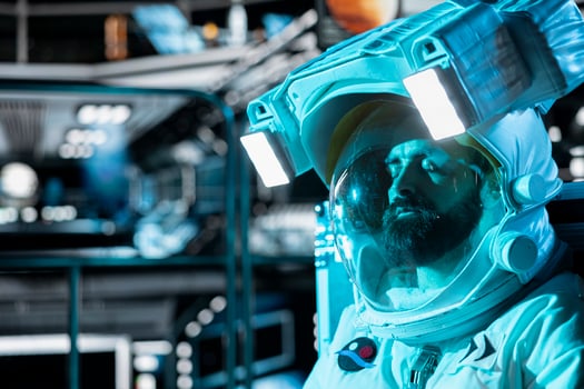 Close up of fatigued astronaut falling asleep in starship during long distance planetary mission. Tired man in space station wearing helmet sleeping on floor during cosmic trip to other planets photo