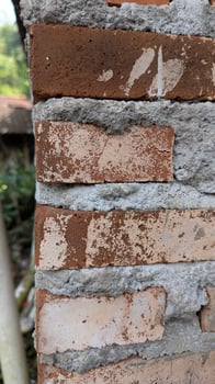 Weathered Brick Wall with Cement Mortar Construction Close-Up Detail photo