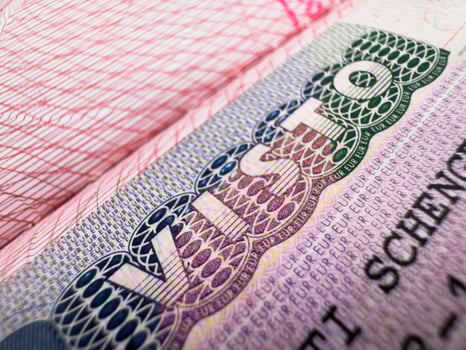 Visa in passport for world travel, EU visa for Italy, tour, airport, customs, news, closed borders, nationality. Macro photo