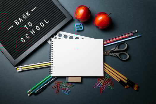 Back to School Letter Board Surrounded by Pencils and Apples photo