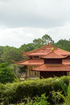 Majestic Pagoda Amidst Verdant Foliage. Asian Temple Landscape and Architecture. Dalat, Vietnam. photo