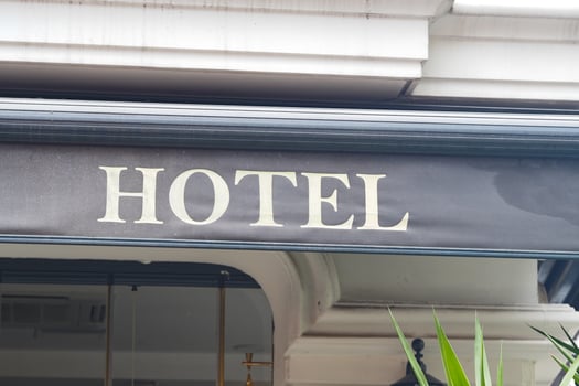 Hotel sign captures urban charm in a busy city area photo