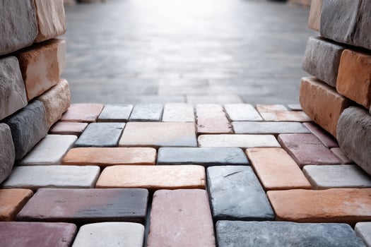 Vibrant natural patterned paving creates visual interest in outdoor space with central copy area photo