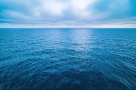 Seascape with deep blue sea and cloudy sky. Natural background photo