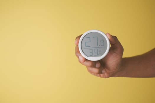 Humidity monitor on a yellow background photo