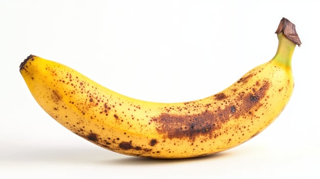 Ripe banana with brown spots photo