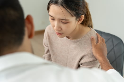 psychiatrist hold shoulders while discussing life and family issues. doctor encourages and empathy woman suffers depression. psychological, save divorce, Hand in hand together, trust, care. photo