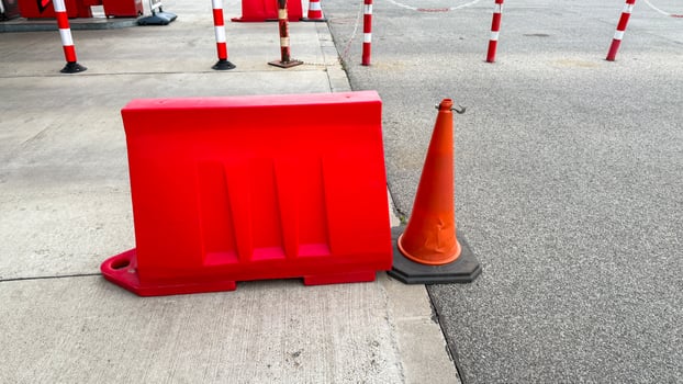 Red barricades contrast pavements grayscale for a parking odyssey think urban festivals or peculiar Barrier Awareness Day photo