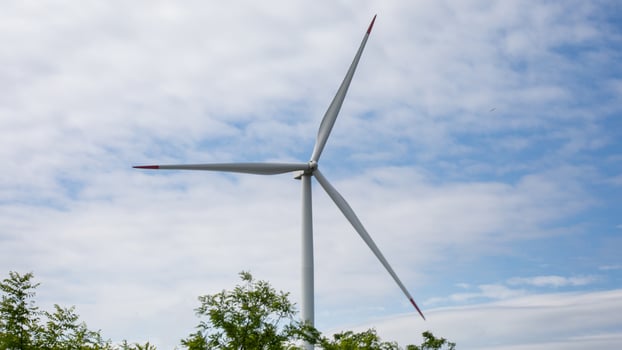 Whispering wind turbine against celestial canvas, energizing eco symphony, green innovations, and Earth Days silent celebration of renewal photo