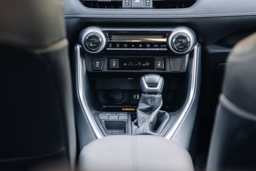 A close-up of the gearbox of a modern, new car. Concept of stylish design. photo