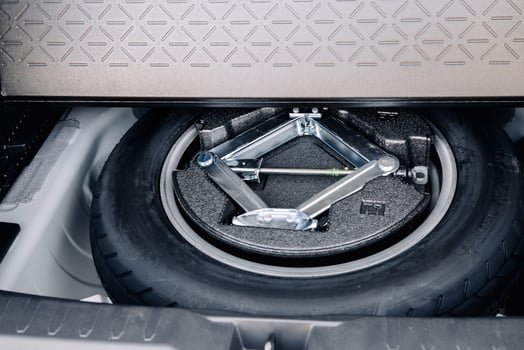 Spare wheel in the trunk of a modern car photo