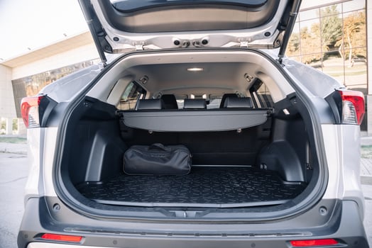 Gray modern car with open empty trunk. Travel or rent modern car concept. photo
