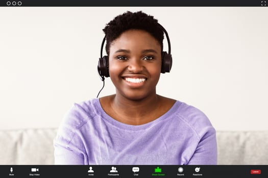 Headshot portrait screen view of smiling young black woman making call with friend or relatives, happy millennial female having virtual meeting online using webcam conference on computer photo