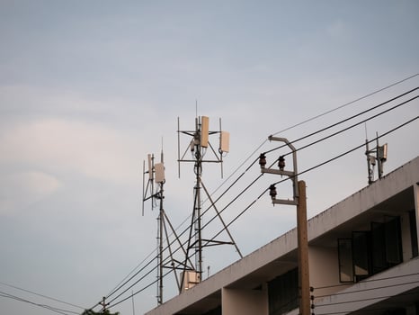 Telecommunication infrastructure installation urban area photography evening sky panoramic view technology advancements photo