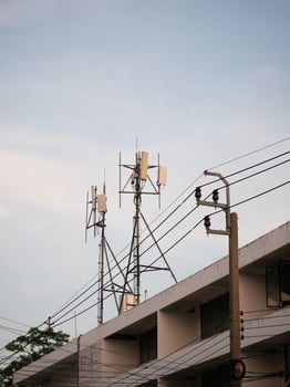 Telecommunication towers erected in urban setting modern infrastructure cityscape daylight technological advancement photo