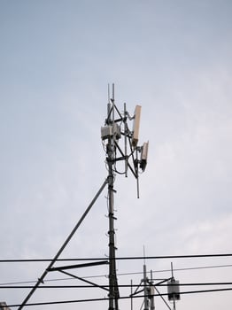 Telecommunication tower installation urban area infrastructure development clear sky elevated view modern connectivity solutions photo