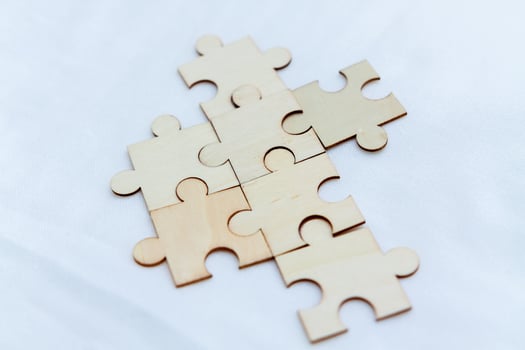 Strategic business planning office workspace puzzle pieces collaborative environment close-up problem-solving concept photo