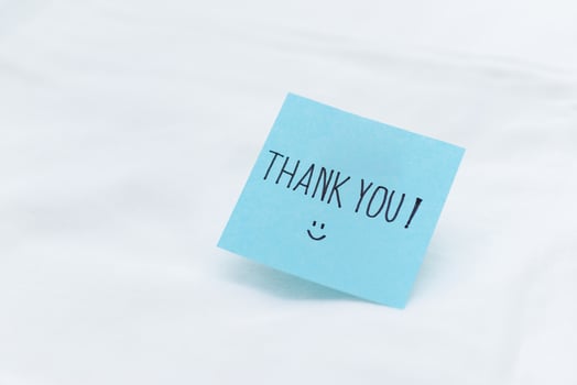 Business appreciation note office desk thank you message professional environment close-up view gratitude concept for engagement photo