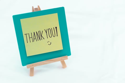 Business appreciation event office space graphic display minimalist environment close-up view thank you concept for growth photo