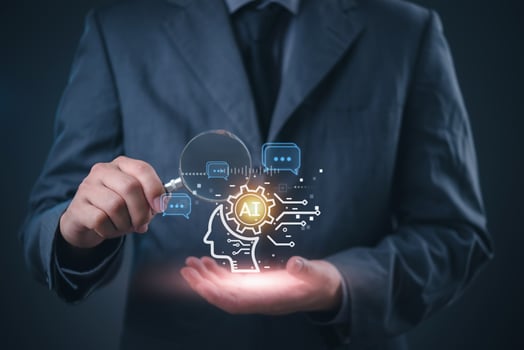 Businessman holding magnifying glass with icons on dark background photo