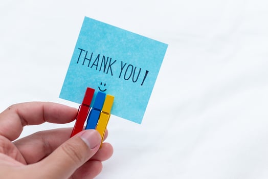 Thank you note handheld gesture home office social media content indoor close-up shot business appreciation concept photo