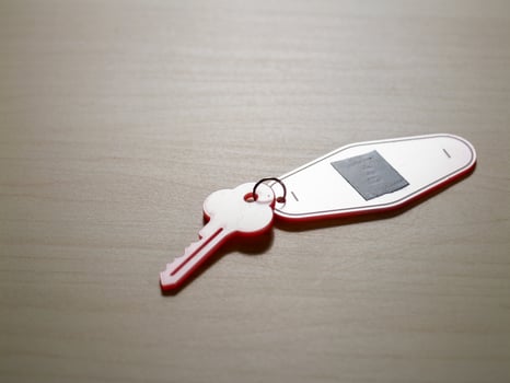 Key on table capturing everyday moments in a minimalist home office photo