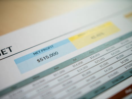 Business financial overview office environment document analysis profit report detailed insights photo