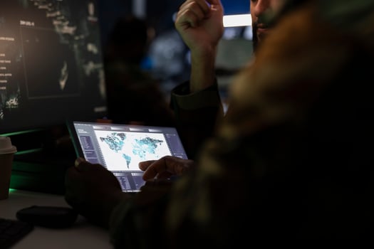 Army officers managing air traffic control using radar surveillance software on tablet. Close up of military agents following enemy units on reconnaissance satellite system using device photo