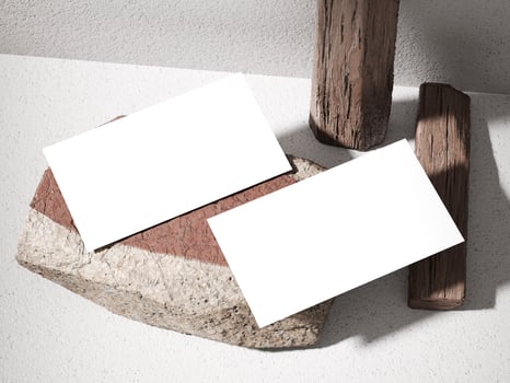 Business card mockup on a stone surface with wooden logs and soft natural lighting. photo