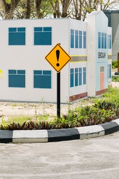 Warning Signs Near School Buildings, Focus on Safety and Awareness photo