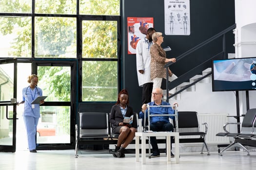 Different people sitting in the clinic waiting area for a checkup exam or discussion with a healthcare expert, young or elderly patients waiting in the lobby for a medical specialist. Health check. photo