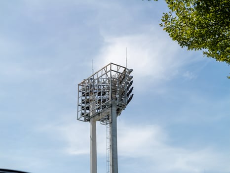 Sports event lighting tower stadium outdoor low angle urban infrastructure photo