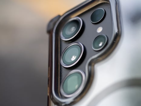 Showcasing smartphone camera technology urban setting product close-up view innovation photo