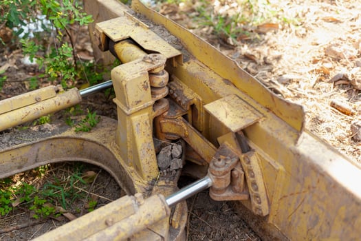 Close-up of heavy machinery maintenance at construction site industrial equipment details photo