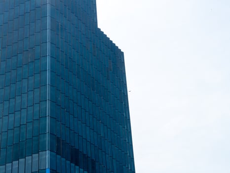 Modern skyscraper reflection urban cityscape architectural clear sky aerial view contemporary design photo
