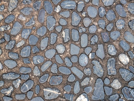 Close-up of stone pebbles textured ground surface in natural aesthetics photo