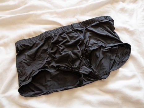 Everyday comfort black boxer shorts a bed lifestyle relaxed environment close-up view photo