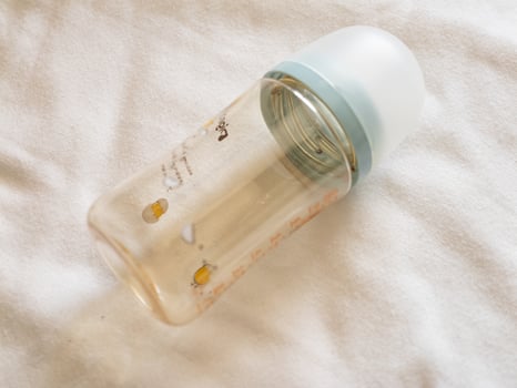 Feeding baby bottles home still life soft lighting close-up parenting essentials photo
