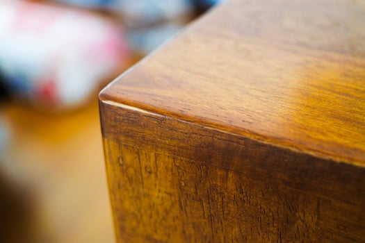 Wooden furniture detail indoor showroom close-up warm lighting artistic view natural beauty photo