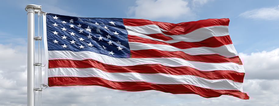 A large american flag waving in the wind photo