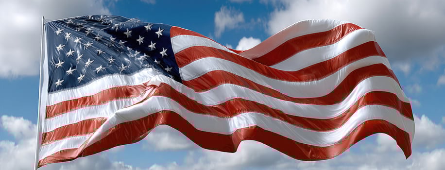 An american flag is blowing in the wind photo