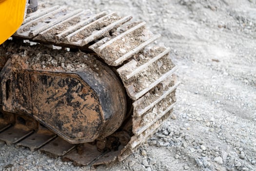 Excavation work progress construction site equipment close-up industrial setting ground level view photo