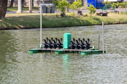 Urban park floating platform aerial view of water-powered paddle boat recreation photo
