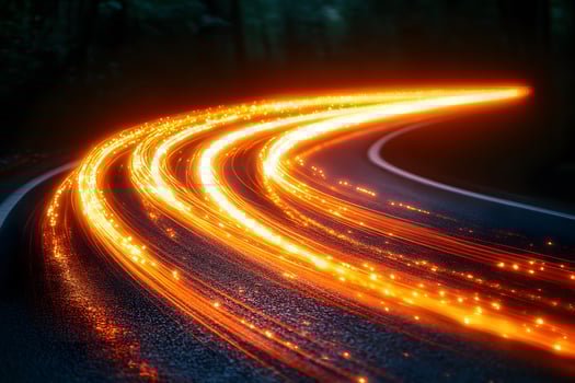 Futuristic Light Trails on Curved Road at Night - Concept of Speed and Energy photo