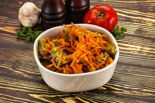 A bowl of food with carrots and onions photo