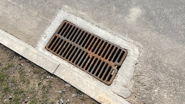 Drainage grate in asphalt. photo